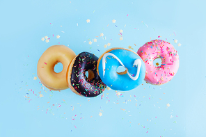 flying doughnuts chain on blue background