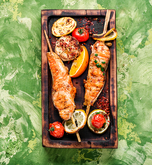 Grilled fish, grilled salmon steak with addition of lemon