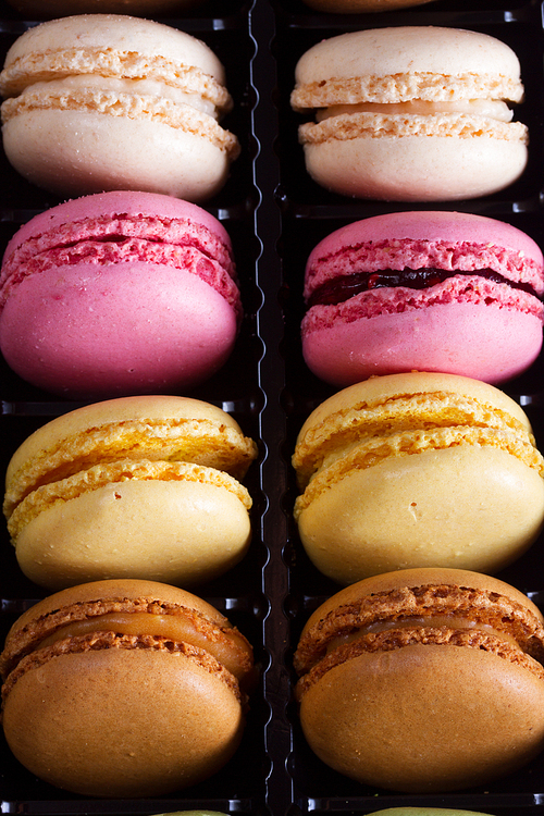 Close up background pile on fresh macaroons cookies