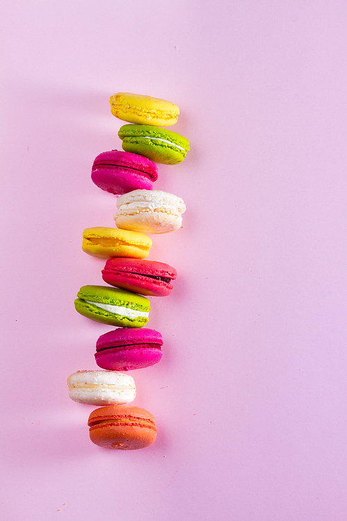 Macaroons cookies on pink background