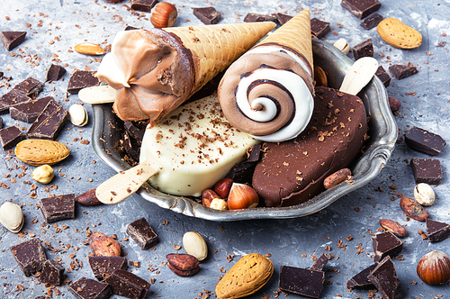 tray with summer ice cream with chocolate filling and nuts