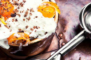 Vanilla ice cream in bowl with orange jam