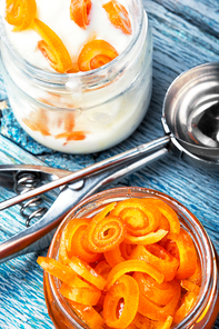 Vanilla ice cream in bowl with orange jam