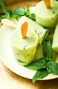 Homemade vanilla ice cream with fresh mint leaves