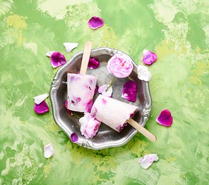 Summer vanilla ice cream with fresh rose flowers