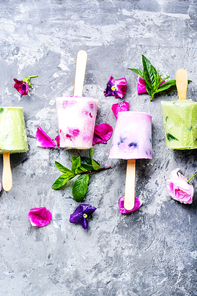 Summer vanilla ice cream with fresh flowers and mint