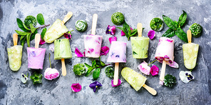 Summer vanilla ice cream with fresh flowers and mint