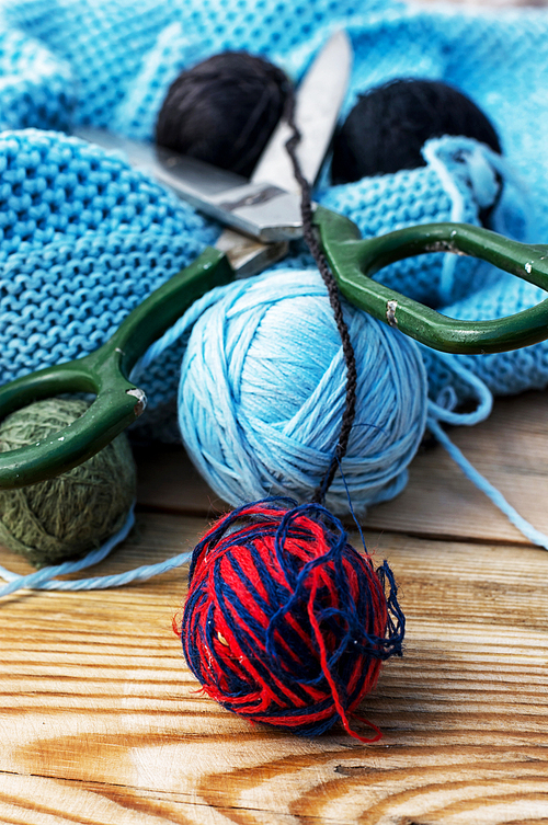 ball of knitting yarn and sewing accessories