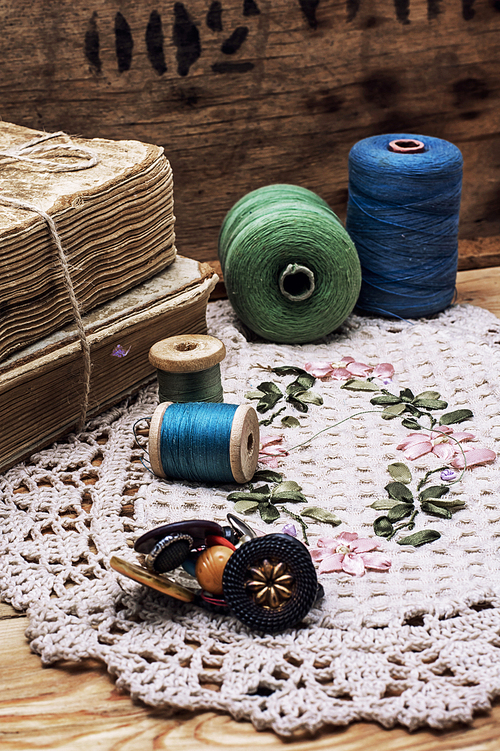 spool sewing thread and buttons in vintage style