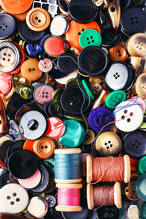 Texture of variety of buttons from clothing and thread.Top view