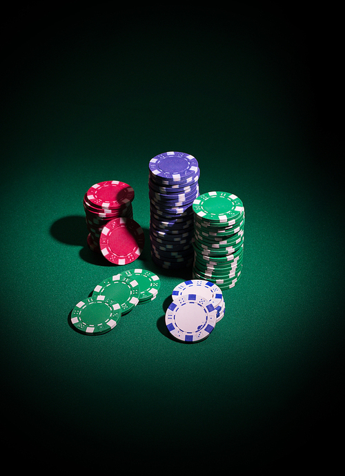 Playing chips on green table