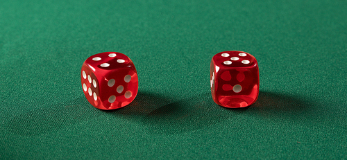 Playing cubes on green table