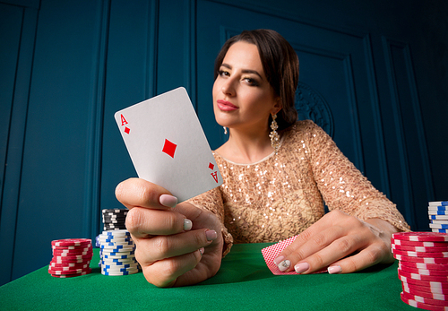 Young woman playing in casino