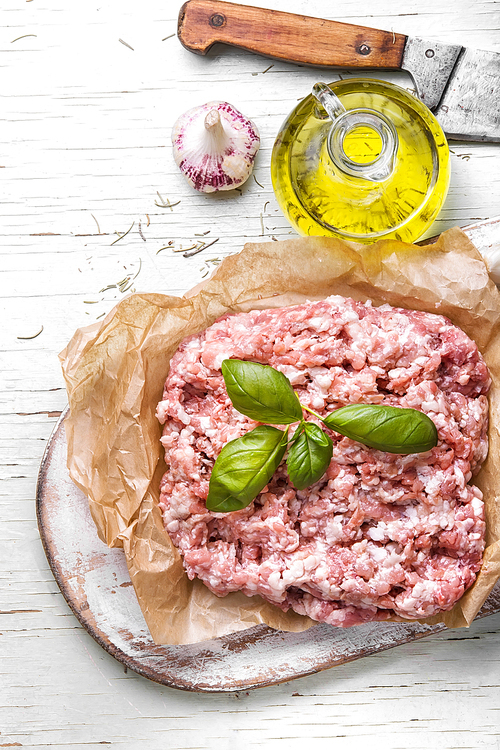 raw minced meat on vintage wooden background