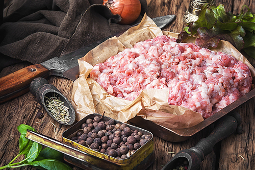 raw minced meat on vintage rustic background