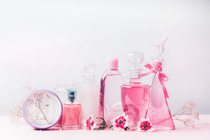 Beauty and cosmetic bottles in pastel color, front view