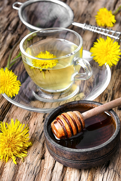 Cup of medicinal tea with honey dandelion