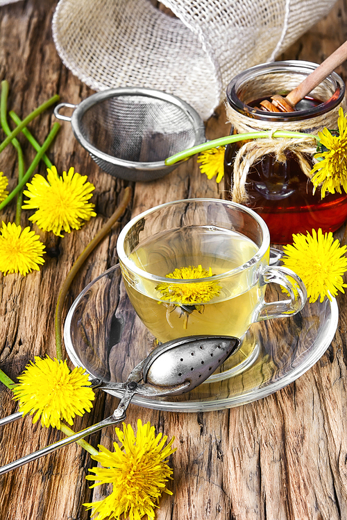 Cup of medicinal tea with honey dandelion