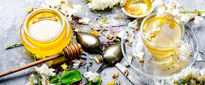 Healing herbal tea with honey from acacia flowers.Herbal tea
