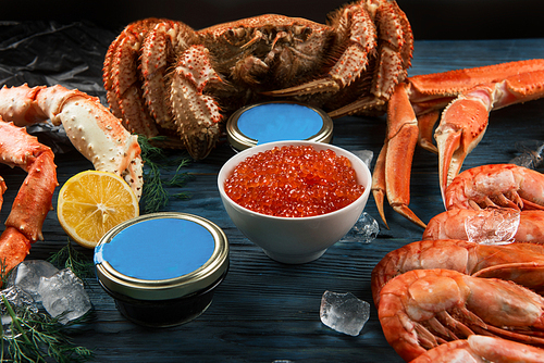 Set of seafood: red and black caviar, limb of hairy crab, limb of snow crab, far eastern kamchatka crab