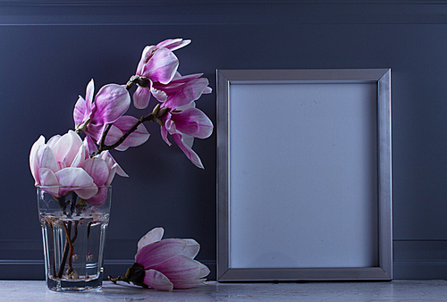 Gray room interior decor with magnolia flowers and poster mock up