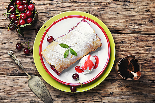 Traditional puff pastry strudel with berries of cherry