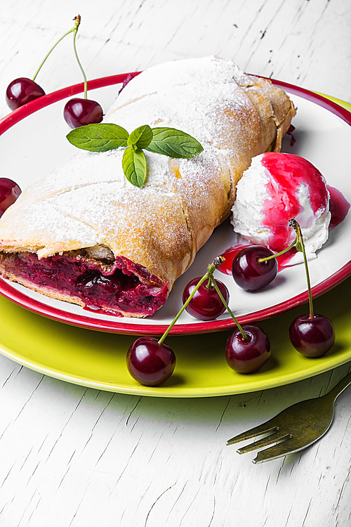 Traditional puff pastry strudel with berries of cherry