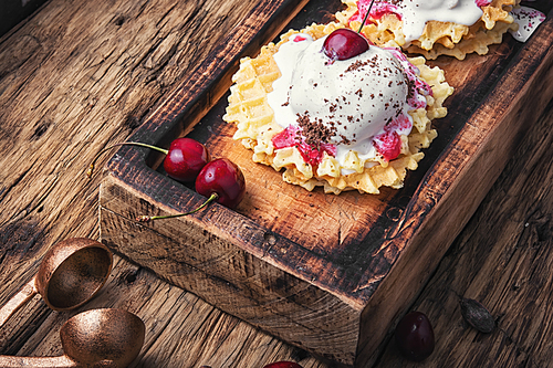 Ice cream on baked wafers with cherries