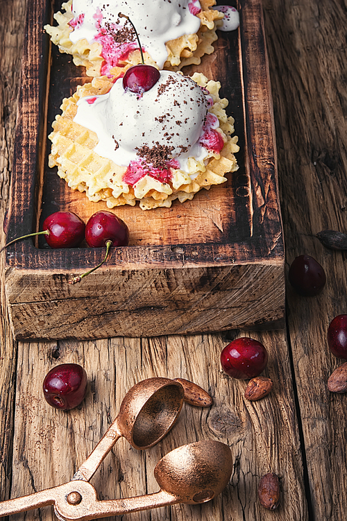 Ice cream on baked wafers with cherries