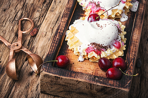 Ice cream on baked wafers with cherries