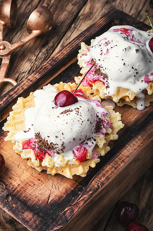 Ice cream on baked wafers with cherries