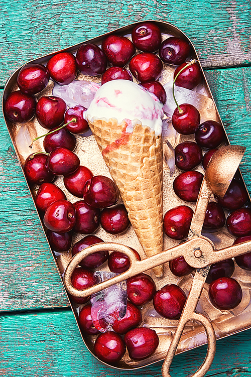 Ice cream in a waffle with cherry on stylish background