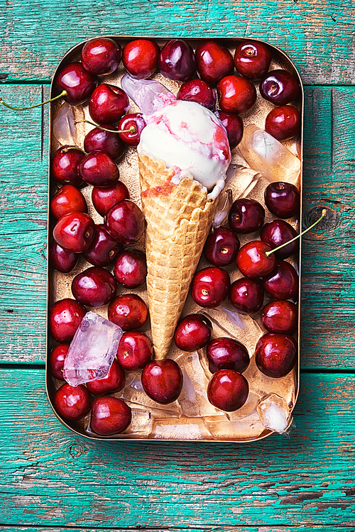 Ice cream in a waffle with cherry on stylish background