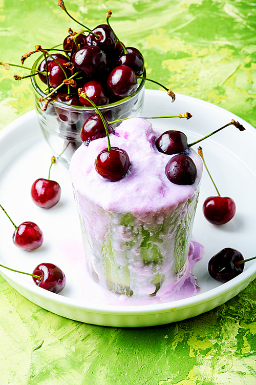 Glass of summer ice cream with cherry flavor