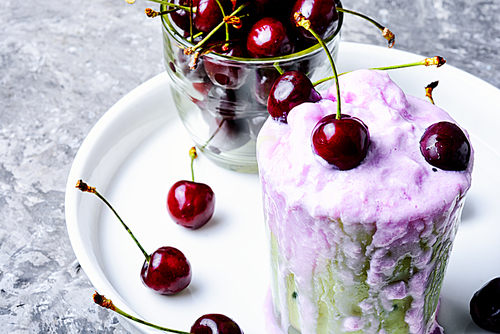 Glass of summer ice cream with cherry flavor