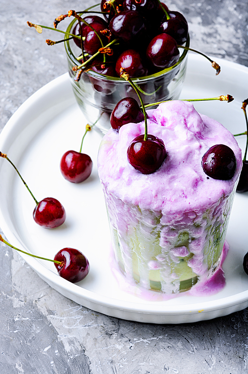 Glass of summer ice cream with cherry flavor