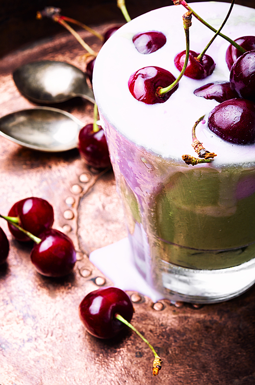 Glass of summer ice cream with cherry flavor