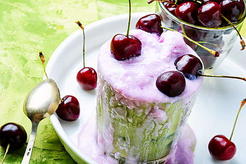 Glass of summer ice cream with cherry flavor