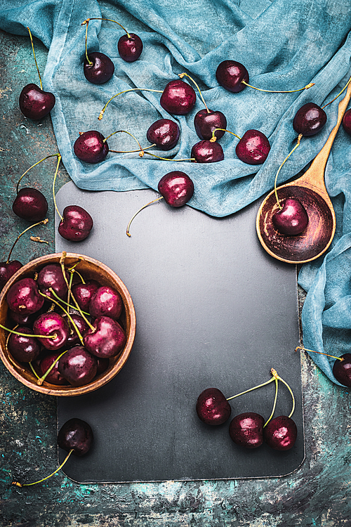 Food background for Cherry berries recipes with cooking spoon and napkin , top view frame