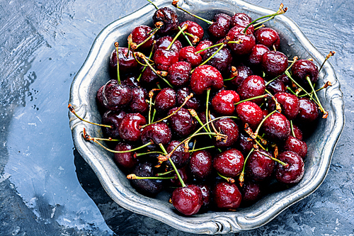 Fresh sweet cherries on stone background.Sweet cherry