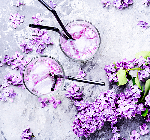 Refreshing summer cocktail with lilac flowers.Detox drink