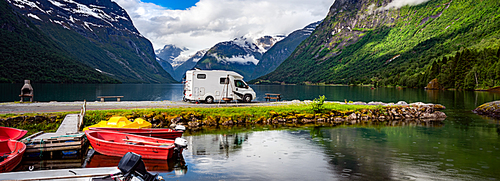 Family vacation travel RV, holiday trip in motorhome, Caravan car Vacation. Beautiful Nature Norway natural landscape.