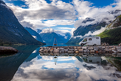 Family vacation travel RV, holiday trip in motorhome, Caravan car Vacation. Beautiful Nature Norway natural landscape.