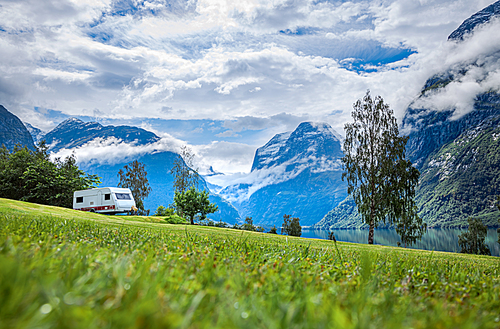 Family vacation travel RV, holiday trip in motorhome, Caravan car Vacation. Beautiful Nature Norway natural landscape.