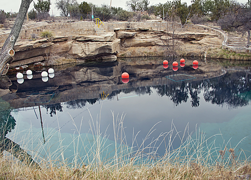 SANTA ROSA, NM, USA - March 11 ,2019. At 80 feet deep with clear blue water, the Blue Hole on Route 66 in Santa Rosa, NM. The Blue Hole of Santa Rosa is a circular, bell-shaped pool east of Santa Rosa