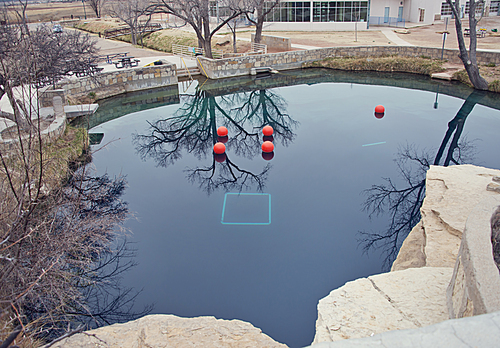 SANTA ROSA, NM, USA - March 11 ,2019. At 80 feet deep with clear blue water, the Blue Hole on Route 66 in Santa Rosa, NM. The Blue Hole of Santa Rosa is a circular, bell-shaped pool east of Santa Rosa