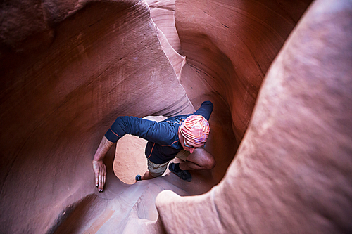 Slot canyon in Grand Staircase Escalante National park, Utah, USA. Unusual colorful sandstone formations in deserts of Utah are popular destination for hikers. Living coral toned.