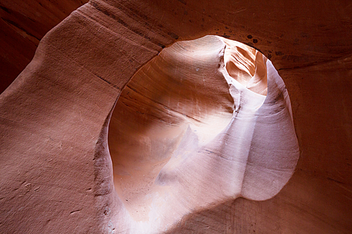 Slot canyon in Grand Staircase Escalante National park, Utah, USA. Unusual colorful sandstone formations in deserts of Utah are popular destination for hikers. Living coral toned.