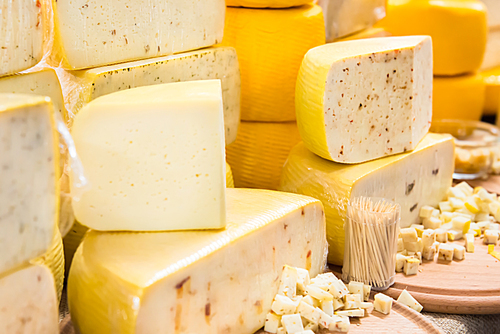 Various types of cheese on wooden desk