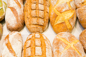 Loafs of fresh bread in bakery shop